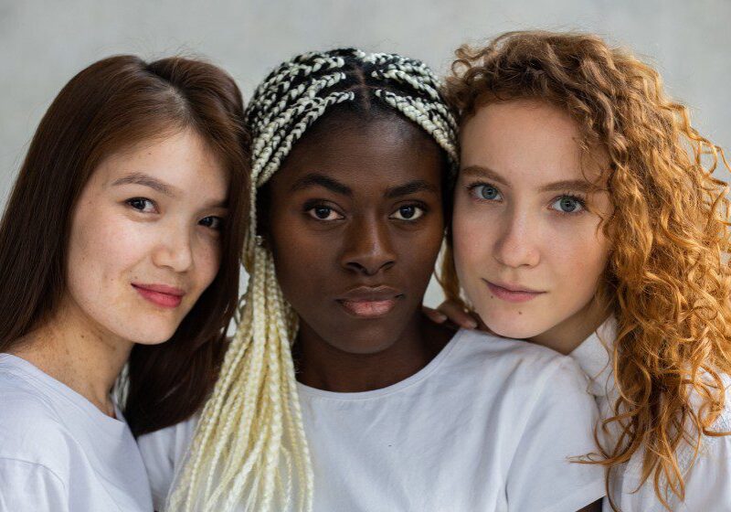 Close up portrait of three young women